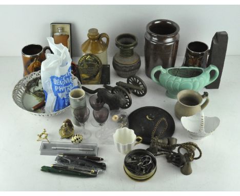 An assortment of items, to include ceramics, a novelty metal dog shaped nut cracker, pens and more