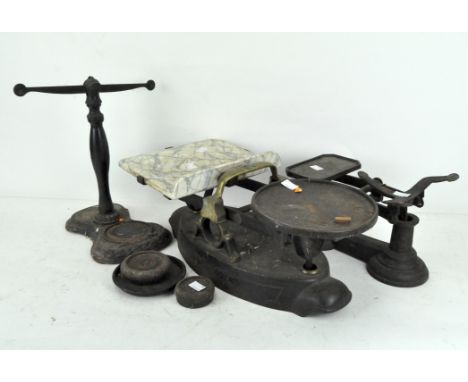 A set of early 20th century kitchen scales with weights, together with two other sets of scales, one with marble top