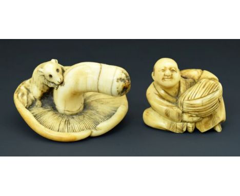 Two Japanese carved ivory netsuke, Meiji period, the first depicting a rat on a mushroom, 4.75cm wide the second a man holdin