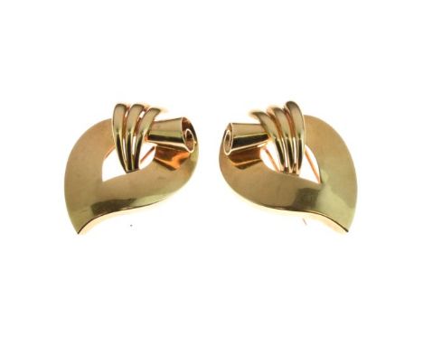 Pair of dress clip brooches, circa 1950, stamped '14k', of parchment scroll design, 28.7g gross  Condition: Light surface wea