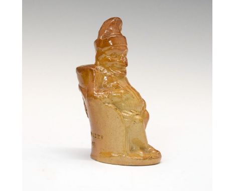 19th Century salt glazed stoneware figural inkwell formed as Mr Punch seated in a chair, impressed mark 'Gardner's Ink Works,