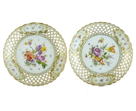 Pair of late 19th/early 20th Century Dresden porcelain circular dishes, each having central painted foliate decoration within