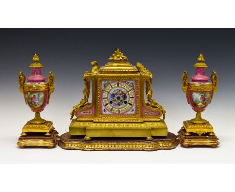 19th Century French ormolu and Sevres style garniture de cheminee, the clock with applied foliate, ribbon and musical instrum