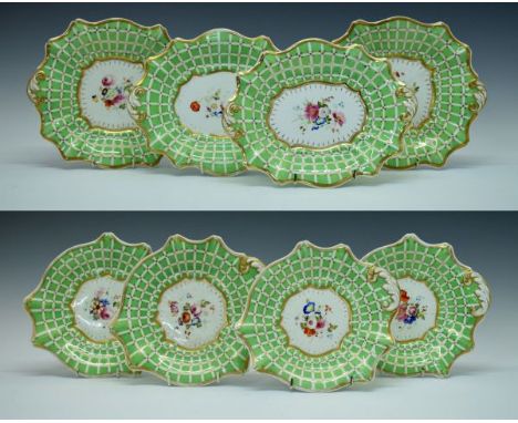 19th Century English porcelain part dessert service having central painted foliate decoration within a gilt highlighted green