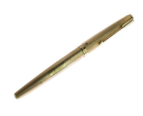 Parker engine turned 9ct gold cased fountain pen, monogrammed D.M.C., 13.25cm long  Condition: **General condition consistent