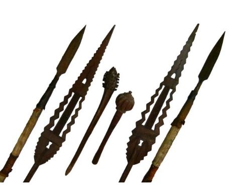 Ethnographica - Two African paddle spears, 163cm long, together with two clubs 43cm and 63cm long and two animal skin bound s