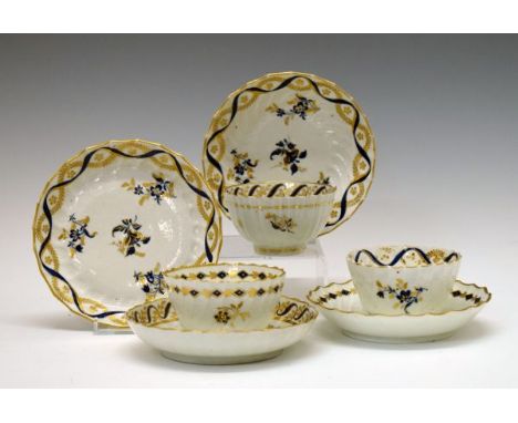18th Century Flight Worcester tea bowl and saucer having a moulded fluted body, painted blue and gilt foliate decoration on a