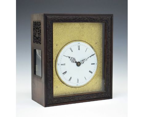 Chinese hardwood cased table clock, the case with glazed and fret carved side panels, sliding front and rear doors, white ena