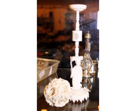 ORIENTAL IVORY ITEMS. Oriental antique ivory puzzle ball and a carved and pierced ivory candle stick