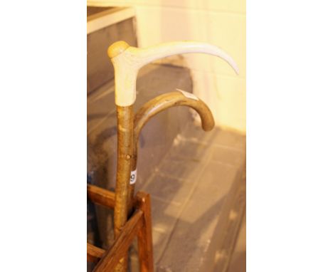 WALKING STICKS. Military walking stick and an antler topped example
