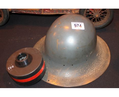 HOME FRONT HELMET. British Home Front WWII helmet and a gas mask filter