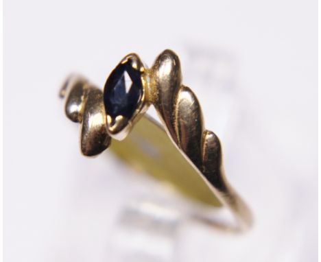 SAPPHIRE SOLITAIRE RING. 9 ct gold marquise cut sapphire solitaire ring, size L/M