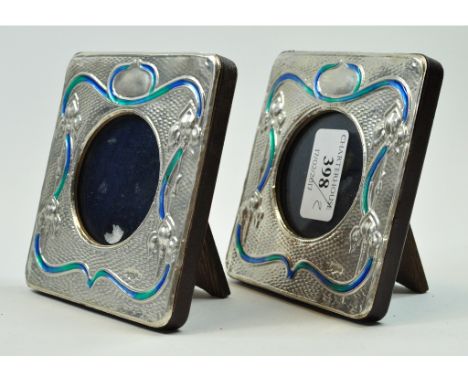 A pair of Art Nouveau style silver and enamel photograph frames, 10.5 cm high 