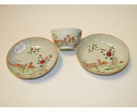 A Chinese porcelain famille rose tea bowl, decorated deer and foliage, and two matching saucers (3) Condition report Some rub