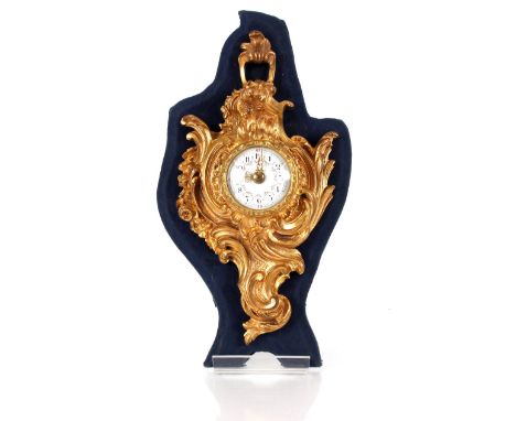 A French gilt metal small Cartel type timepiece,&nbsp;of small size in the Rococo manner, having circular floral enamel dial,
