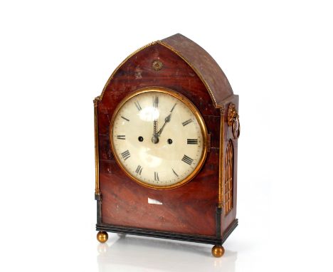 An early 19th Century mahogany and brass cased bracket clock,&nbsp;the circular enamel Roman numeral dial supporting an eight