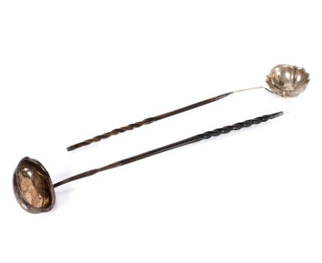 A George III silver toddy ladle,&nbsp;with whalebone twist handle; and a unmarked white metal similar (2)