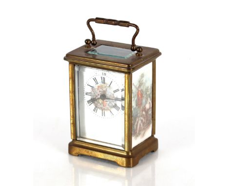 A brass and enamel panelled carriage clock,&nbsp;decorated romantic and gural scenes, 11cm high