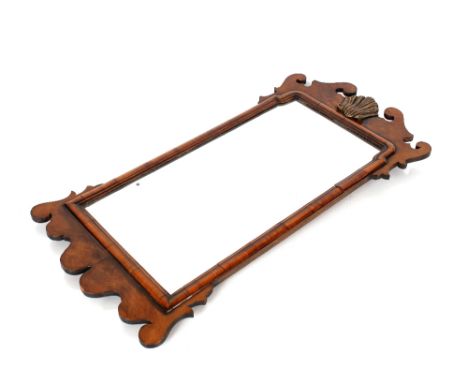 A walnut&nbsp;Chippendale design fret carved wall mirror, with gilt central motif and cushion frieze, 78cm x 39cm&nbsp;