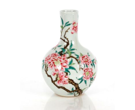 A Chinese famille rose vase,&nbsp;of baluster form decorated with enamels of blossom and small branches with square blue seal