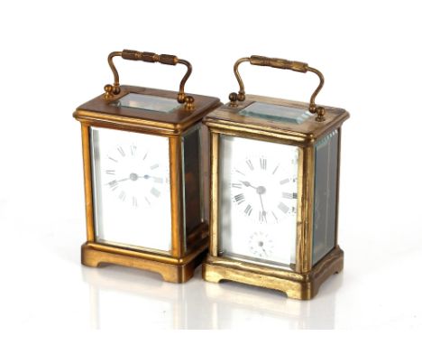 A brass carriage clock,&nbsp;with white enamel Roman numeral dial, 11cm high; and another similar, enamel dial AF (2)
