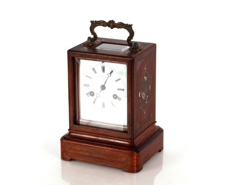 A 19th Century rosewood and mother of pearl and brass inlaid carriage clock,&nbsp;by Petonie Leon Paris, striking on a bell