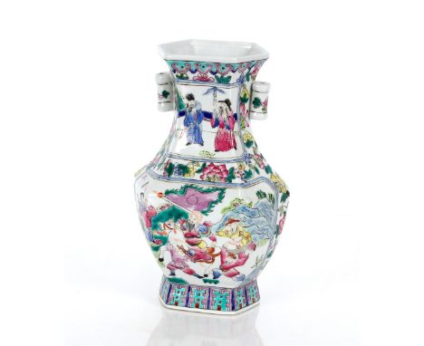 A Chinese vase of hexagonal baluster form, decorated in enamels with interior scene and triumphant scene to verso, flanked by