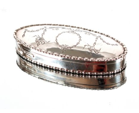 An Edwardian engraved oval silver snuff box,&nbsp;decorated with swags and musical instruments, Chester 1909,&nbsp;9.5cm&nbsp