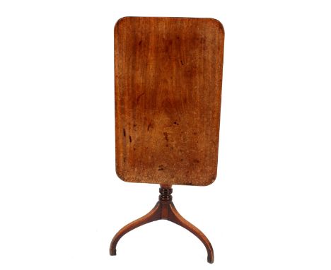 A Georgian&nbsp;mahogany tripod table,&nbsp;the rectangular tilt top raised on a ring turned column and triple splay, 83cm x 