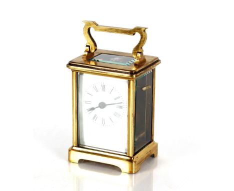 A brass carriage timepiece, having white enamel Roman numeral dial, 11.5cm high 