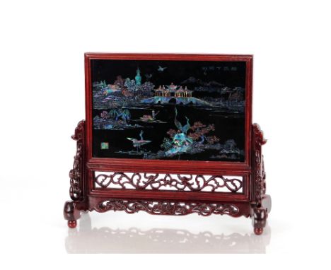 A Chinese carved hardwood and pieced&nbsp;table screen,&nbsp;decorated animals, lake, landscapes, bridge and pagodas, mother 