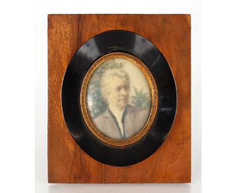 A late 19th / early 20th Century oval miniature portrait of gentleman in walnut and ebonised frame