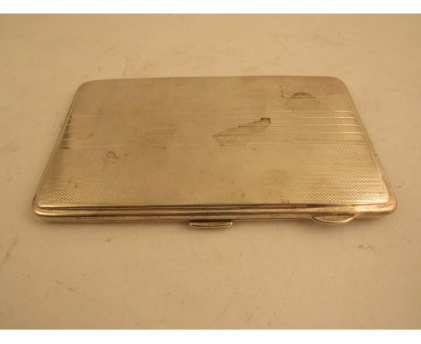 A silver cigarette case with gilded interior and engine turned pattern, Birmingham 1941  