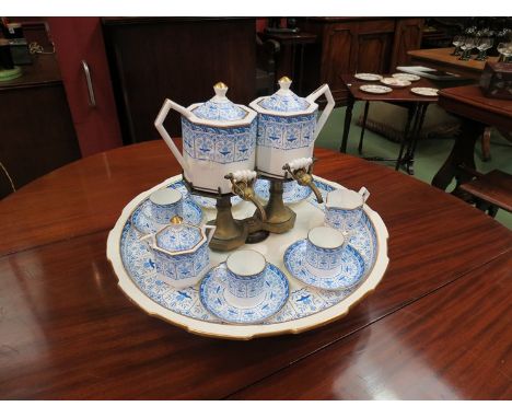 A Wedgwood part tea service Lazy Susan, blue and white decoration, two tea urns, milk jug, sucrier and five cups and saucers