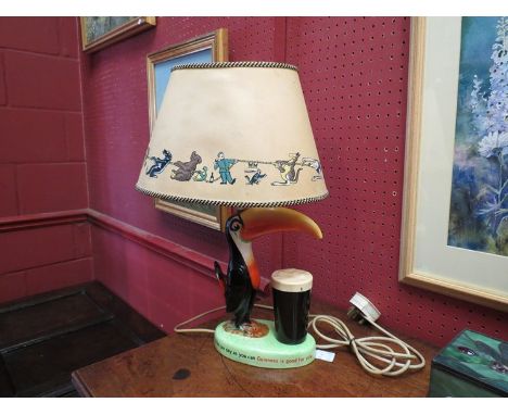 An original Carlton ware hand painted Guinness Pelican table lamp (with shade)