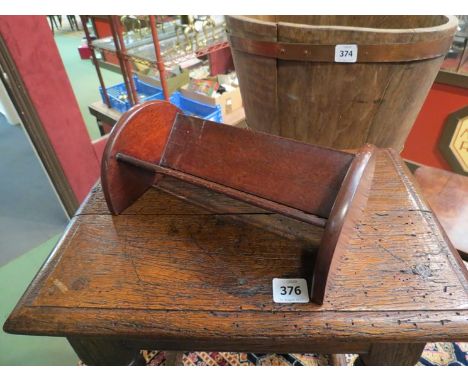 A mahogany book trough of small proportions