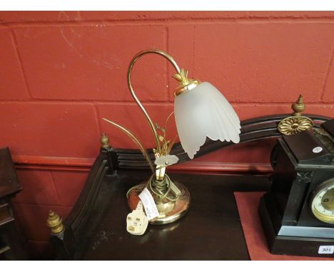 A brass table lamp as a flower with frosted glass shade 