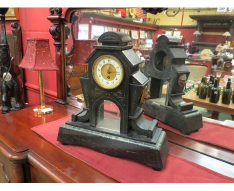 A large slate mantel clock of architectural design, lion mask handles  