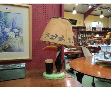 An original Carlton ware hand painted Guinness Pelican table lamp (with shade)