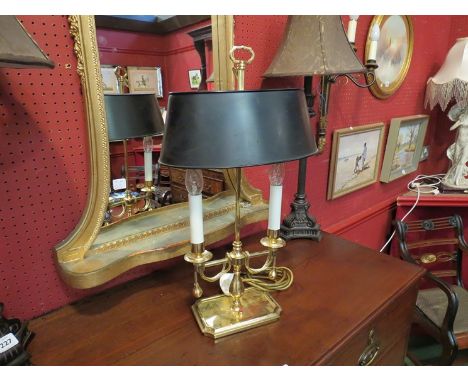 A brass twin arm lamp with height adjustable metal shade