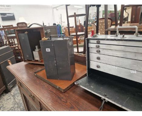 A cased pair of German fuel cans and an alloy tool cabinet. 