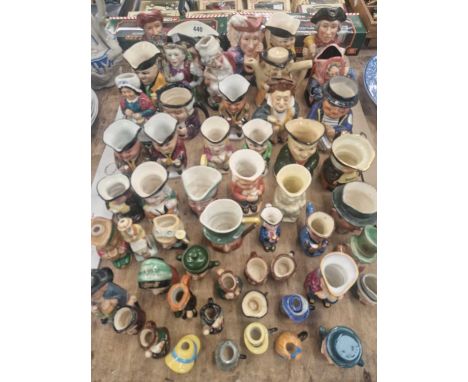 A collection of ceramic character jugs