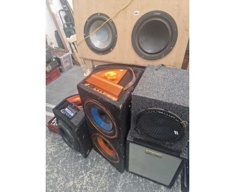 A group of in-car and other large speakers and amplifier units. 