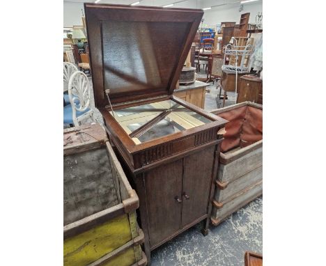 An oak cabinet converted for drinks. 