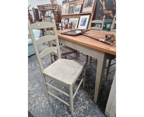 A good quality modern cedar topped kitchen table together with four painted ladder back chairs to match.