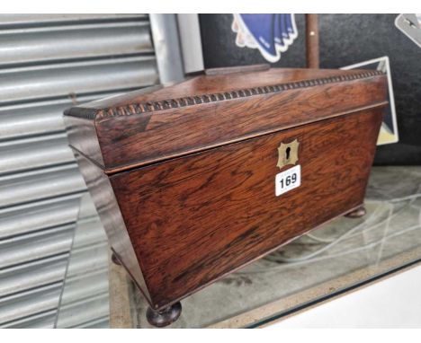 An early 19th C. rosewood sarcophagus tea caddy