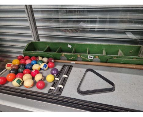 A tunnel bagatelle set with cue and balls
