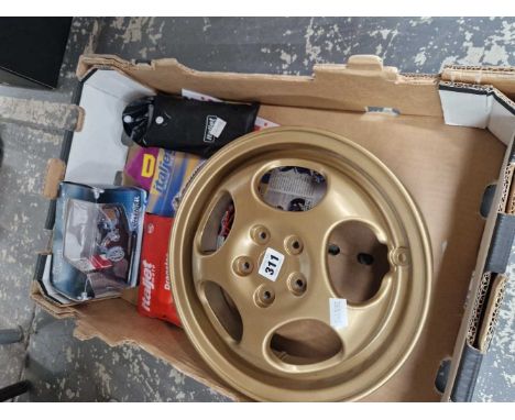 An Italjet gilt metal scooter wheel, two sets of Italjet wheel changing kit, instructions and a boxed die cast scooter