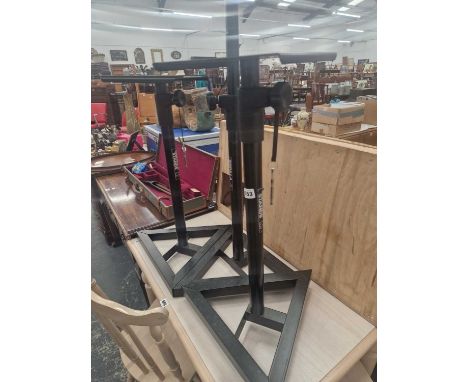 Three heavy-duty speaker stands.