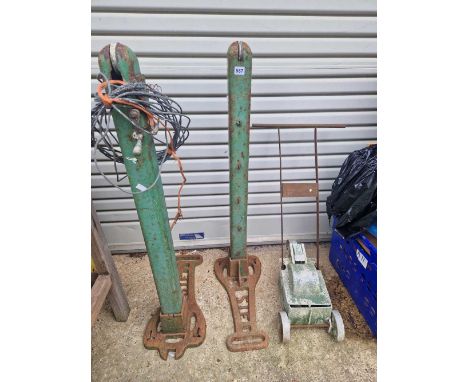 Vintage cast iron tennis posts and a line marker